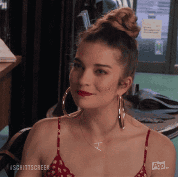 Alexis from &quot;Schitt&#x27;s Creek&quot; gasping and looking happy