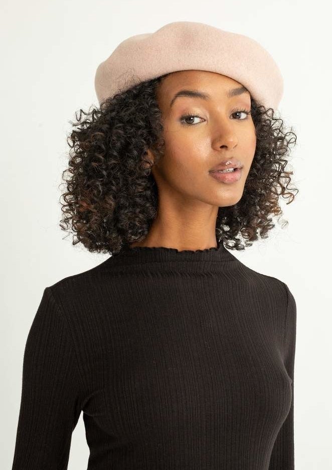Model wearing beige beret