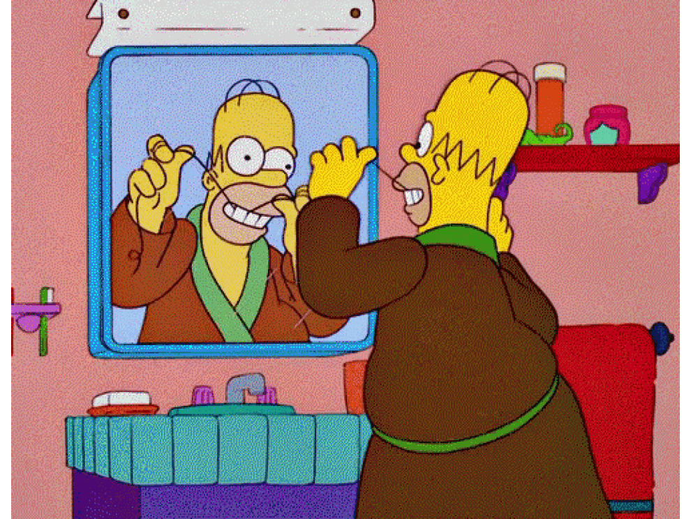 Homer Simpson flossing in the mirror