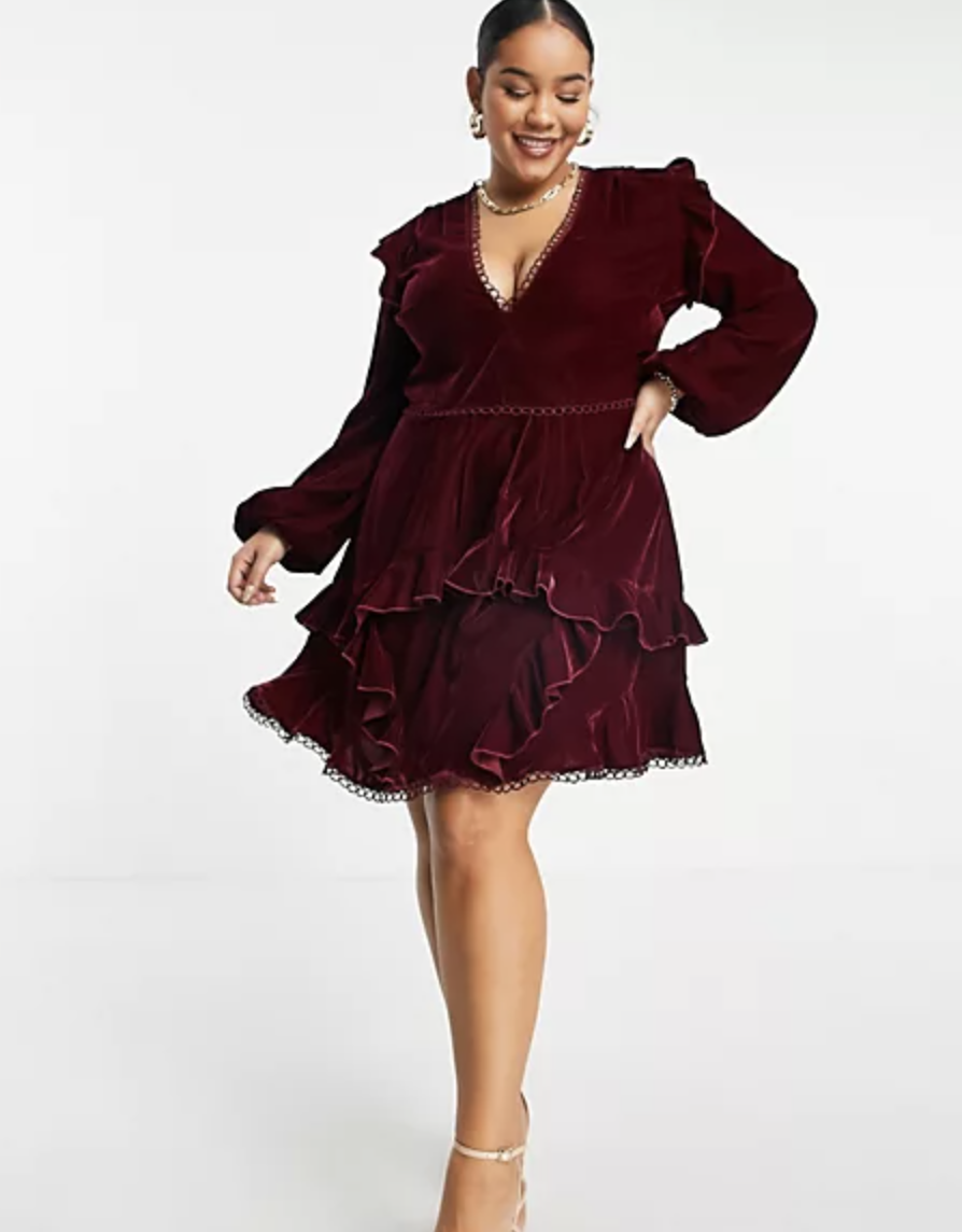 Model wearing burgundy dress