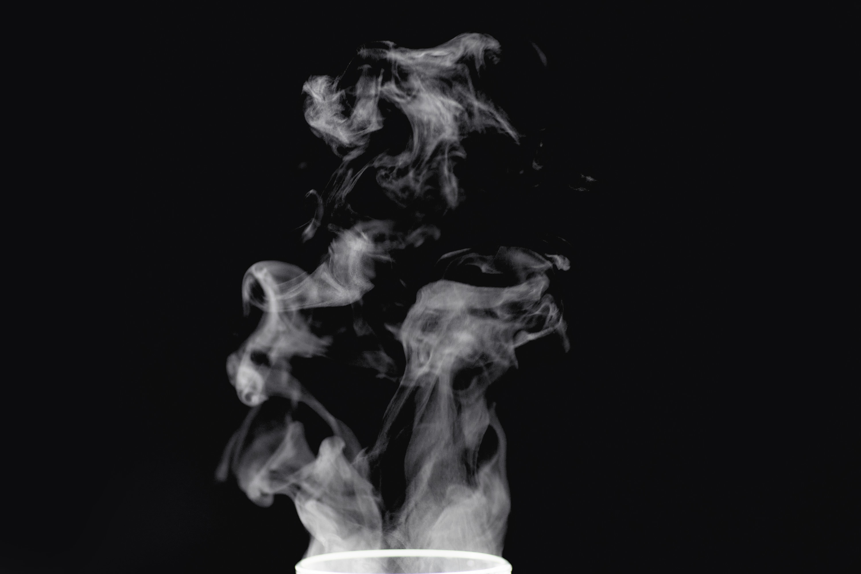 Smoke in the air against a black background