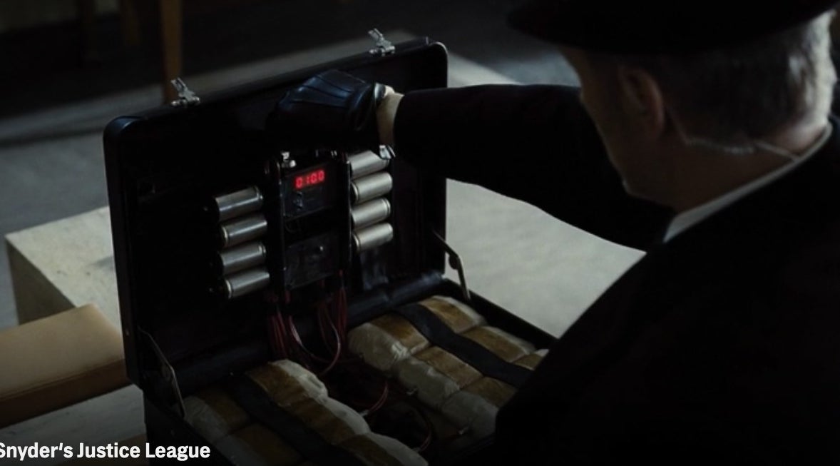 A terrorist activating a briefcase bomb with a key in &quot;Zack Snyder&#x27;s Justice League&quot;