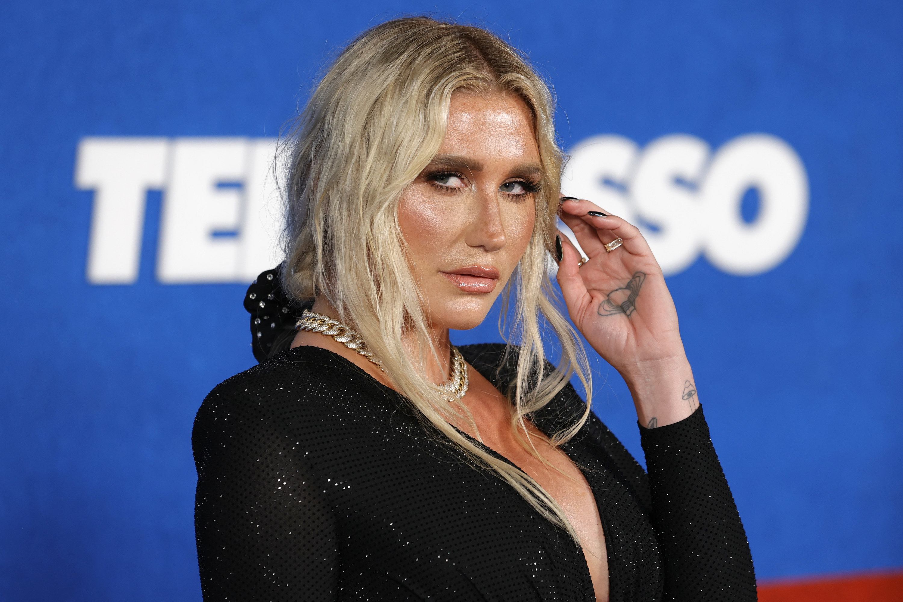 Kesha looking at the camera with a sultry expression