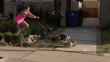 Character pushing a lawn mower down the street