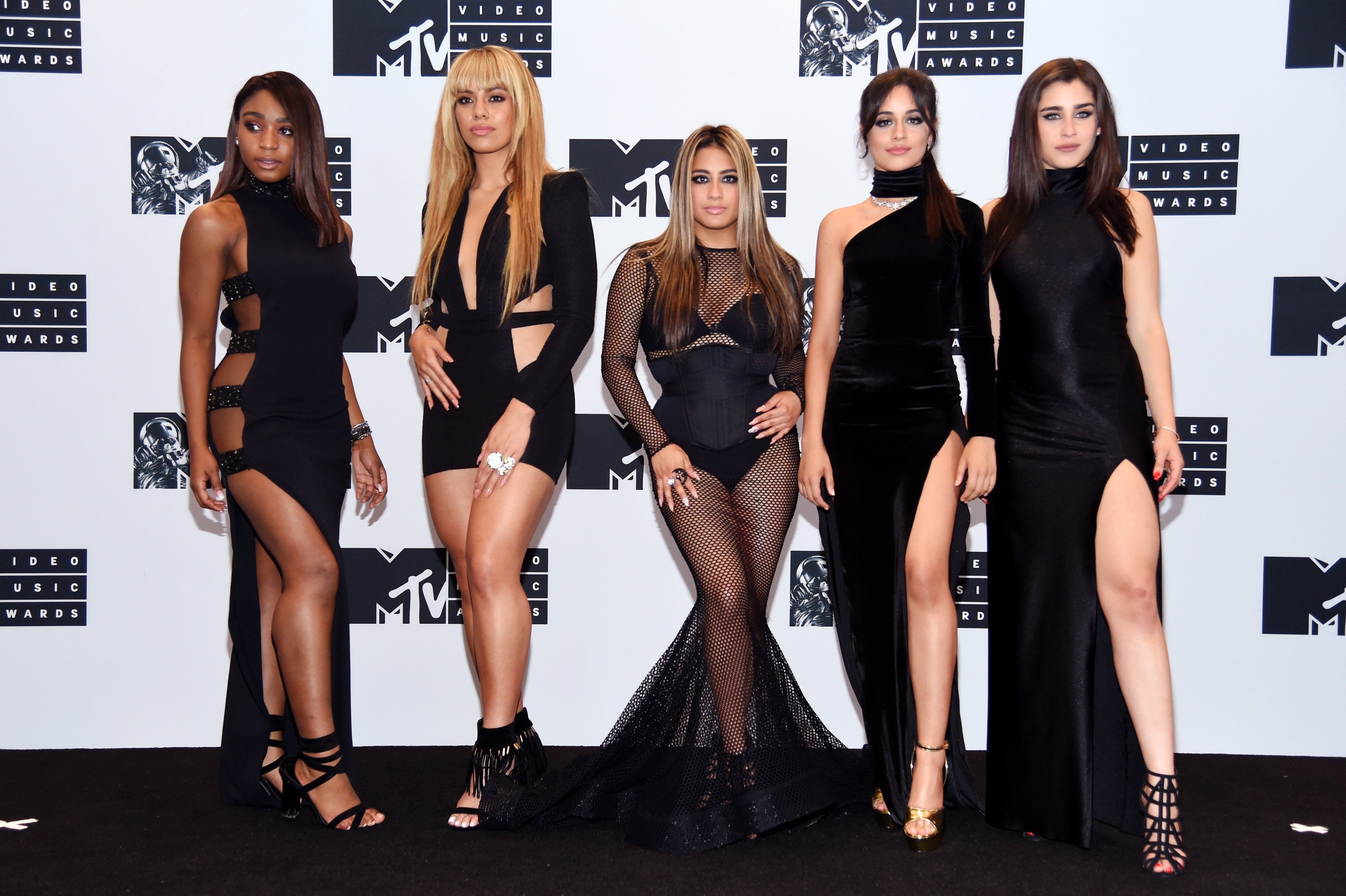 Fifth Harmony pose at a step-and-repeat