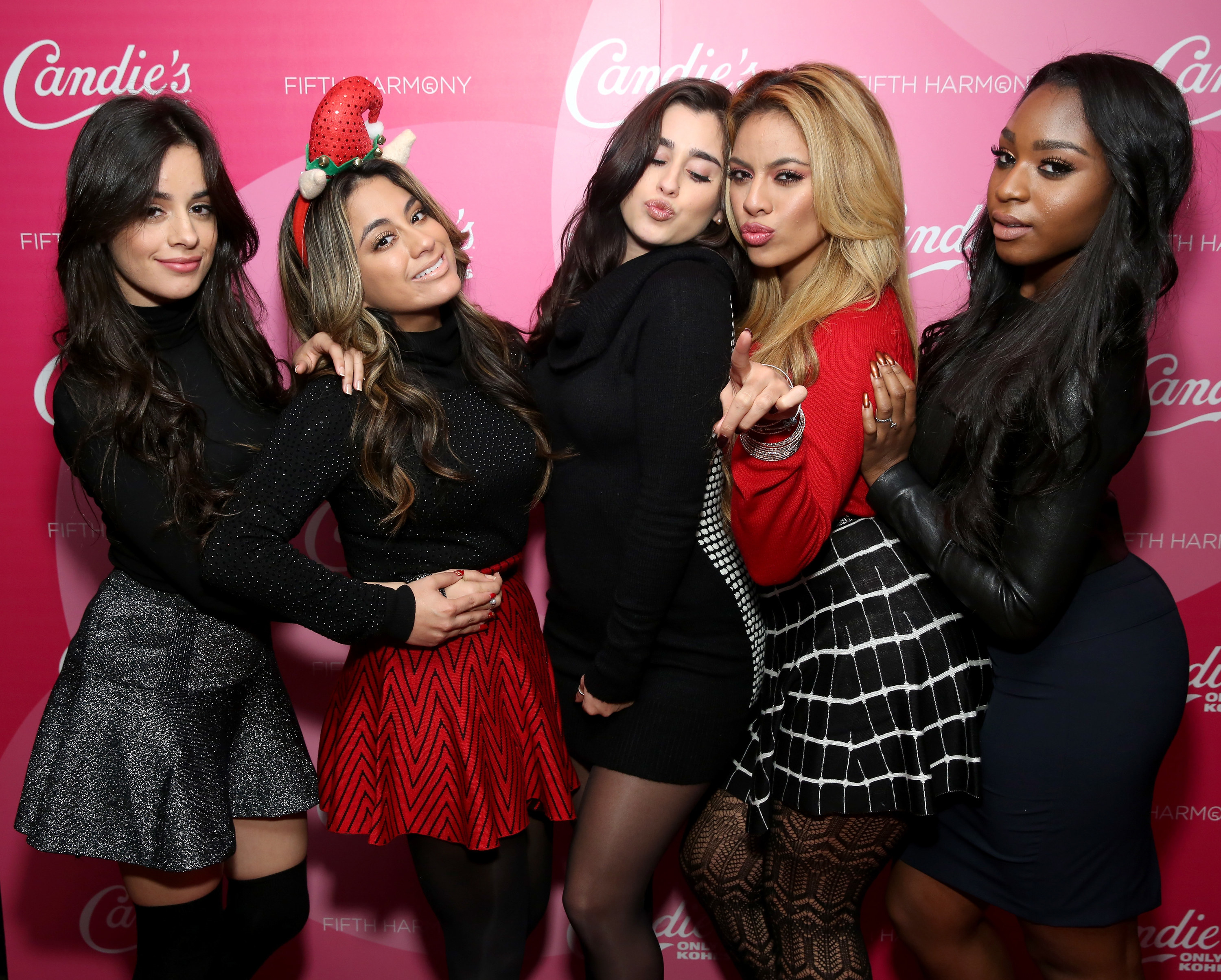 Fifth Harmony blow kisses at an event