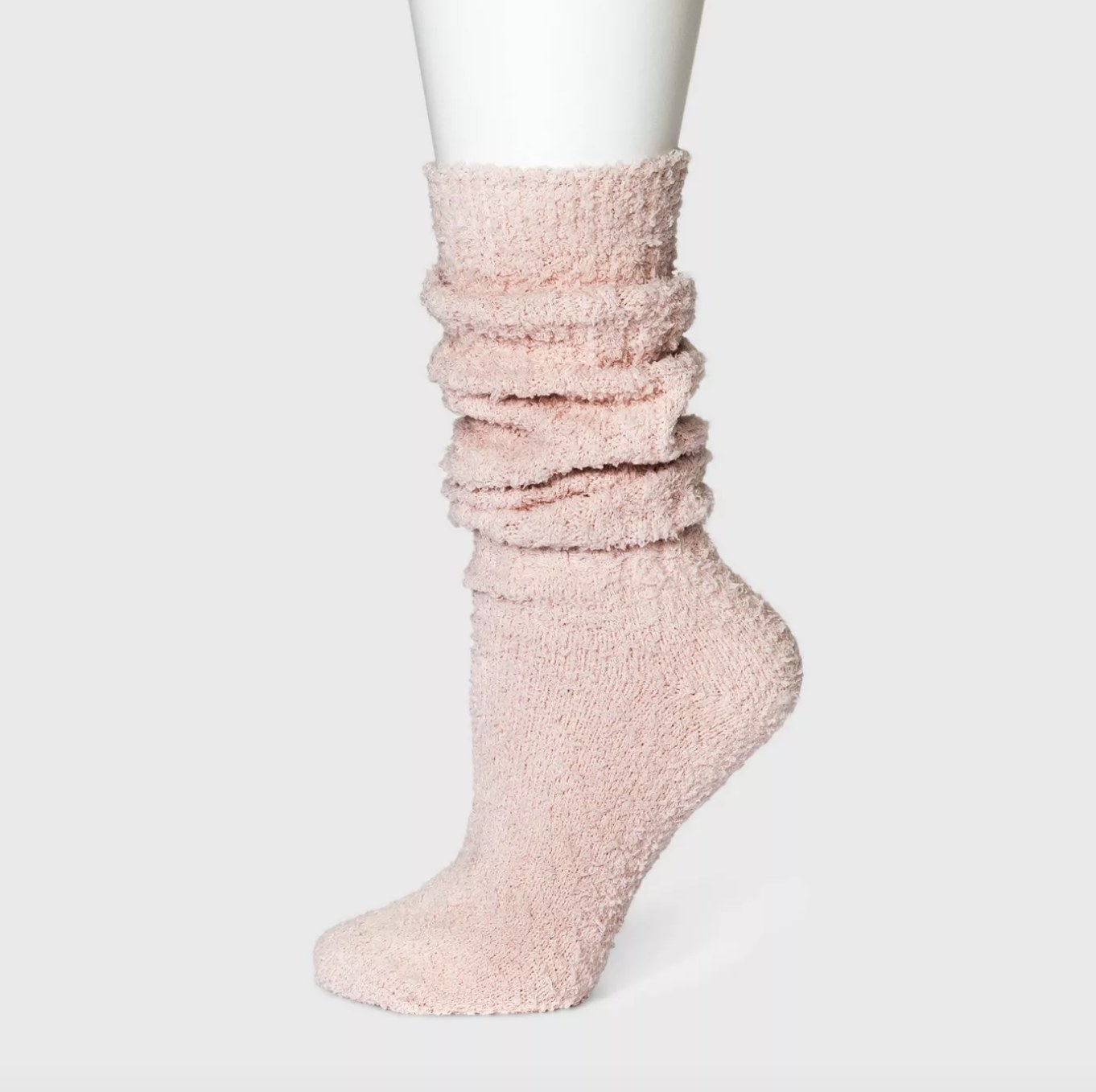 The fluffy pink crew socks slouch right at the ankles
