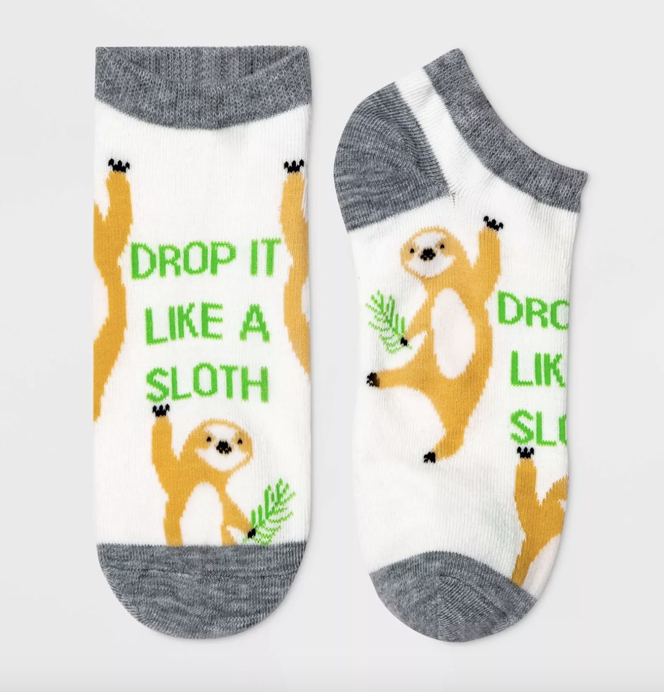 The socks say &quot;DROP IT LIKE A SLOTH&quot; and have tan sloths holding green vegetation