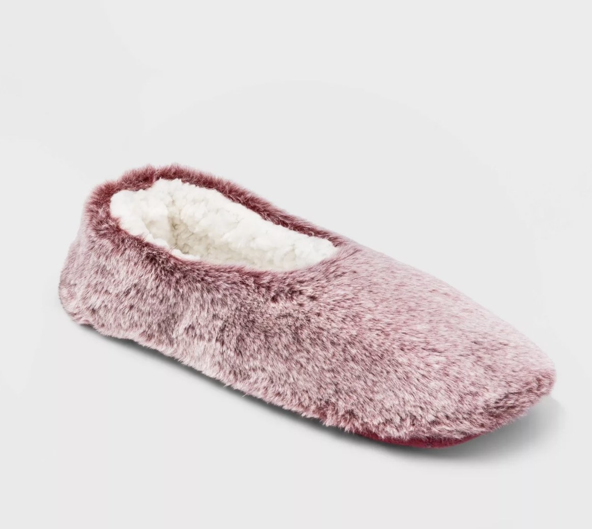 The burgundy slipper socks have a plush white inside