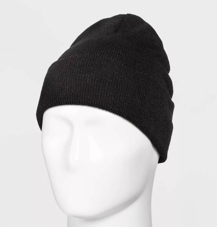 The black beanie is snugly fit on a mannequin&#x27;s head