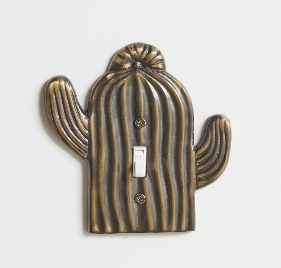 The brass-colored cactus light switch cover