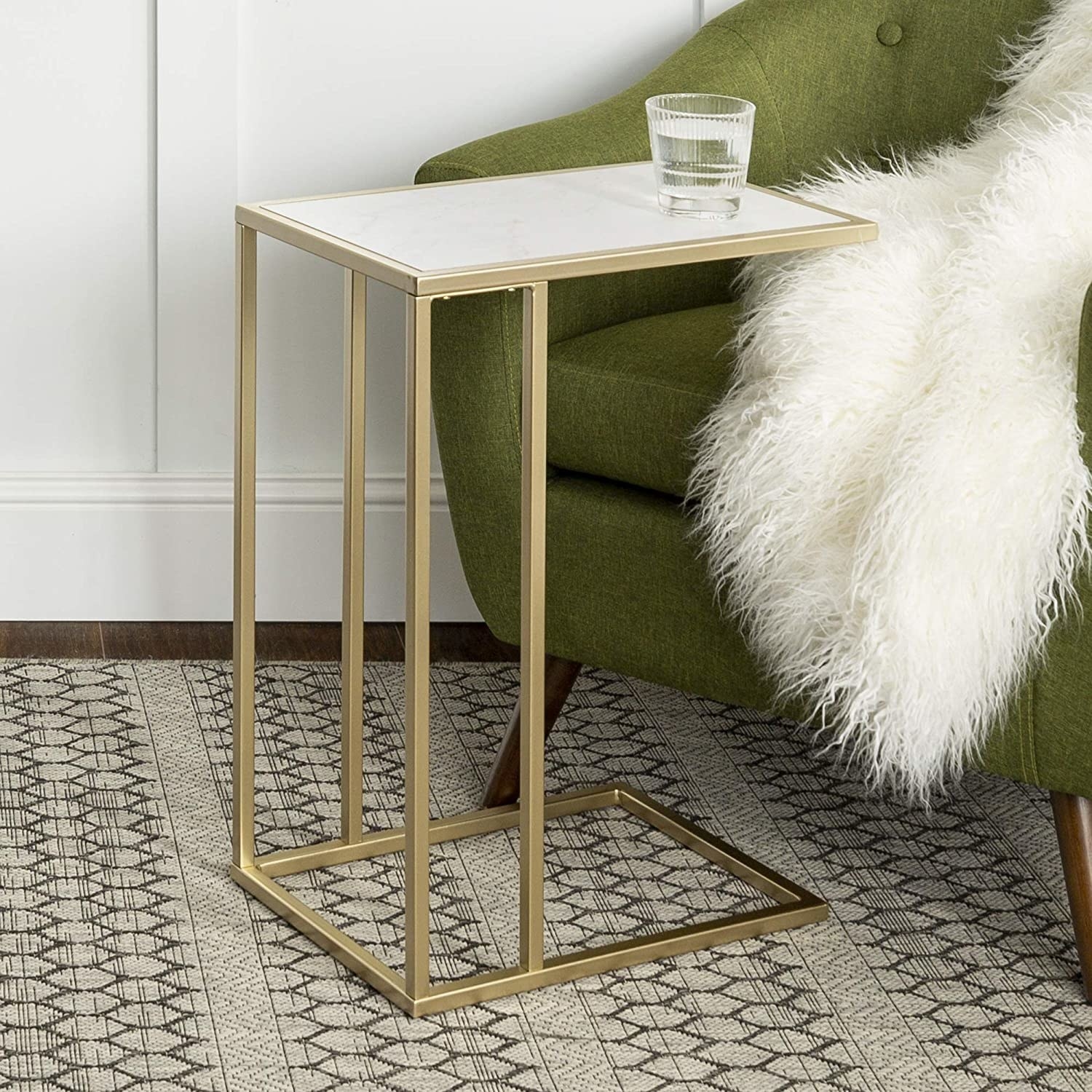 The faux marble and brass C-shaped table