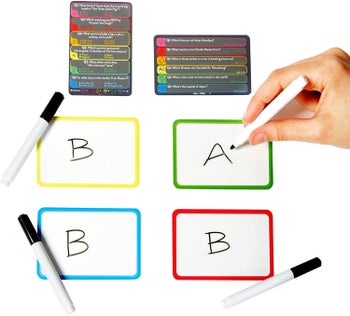 someone writing down their answer to a trivia question