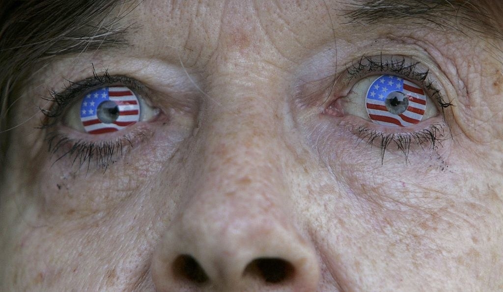 an older woman with american flag contact lenses