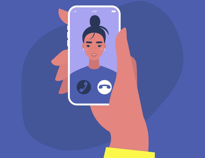 An illustration of a hand holding a smartphone with a person facetime