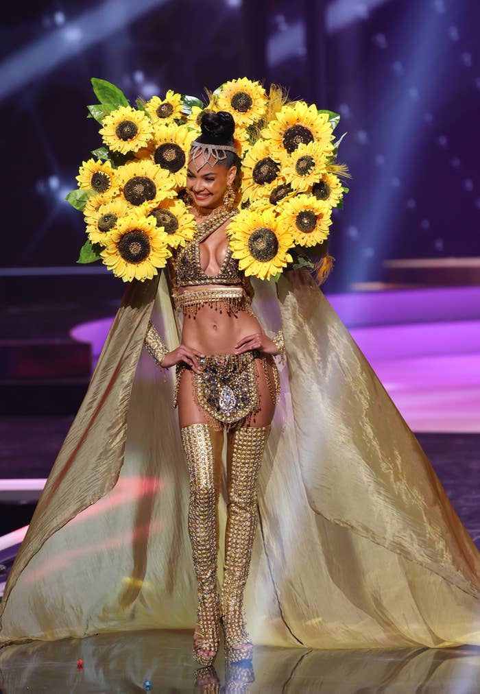miss dominican republic wearing an outfit made of sunflowers