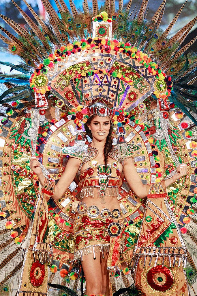 miss mexico wearing an extremely elaborate and colorful beaded dress