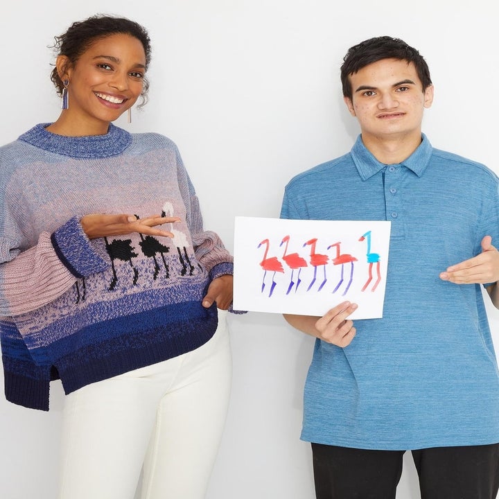 Model wearing the flamingo sweater next to the artist who created the drawing that inspired the design
