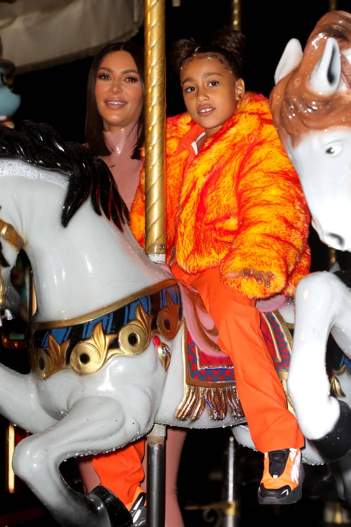 Kim and North on a merry-go-round