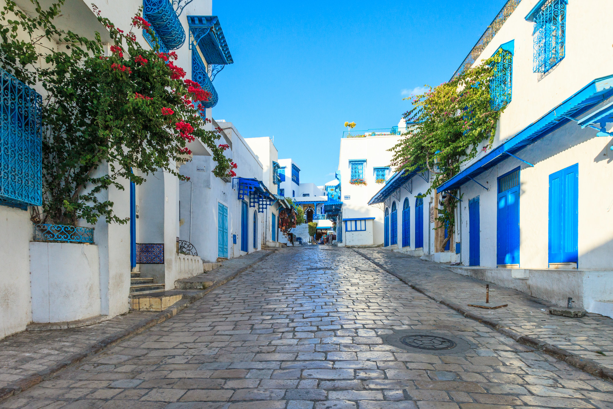 A whitewashed village with blue doors