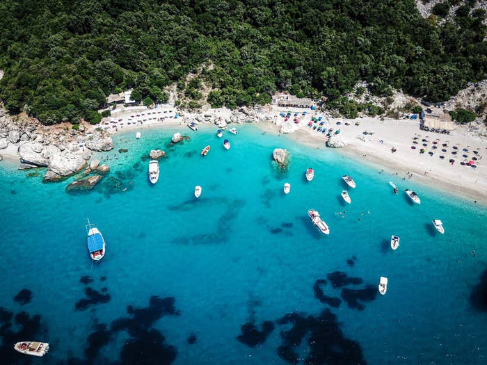 A beach with very blue water