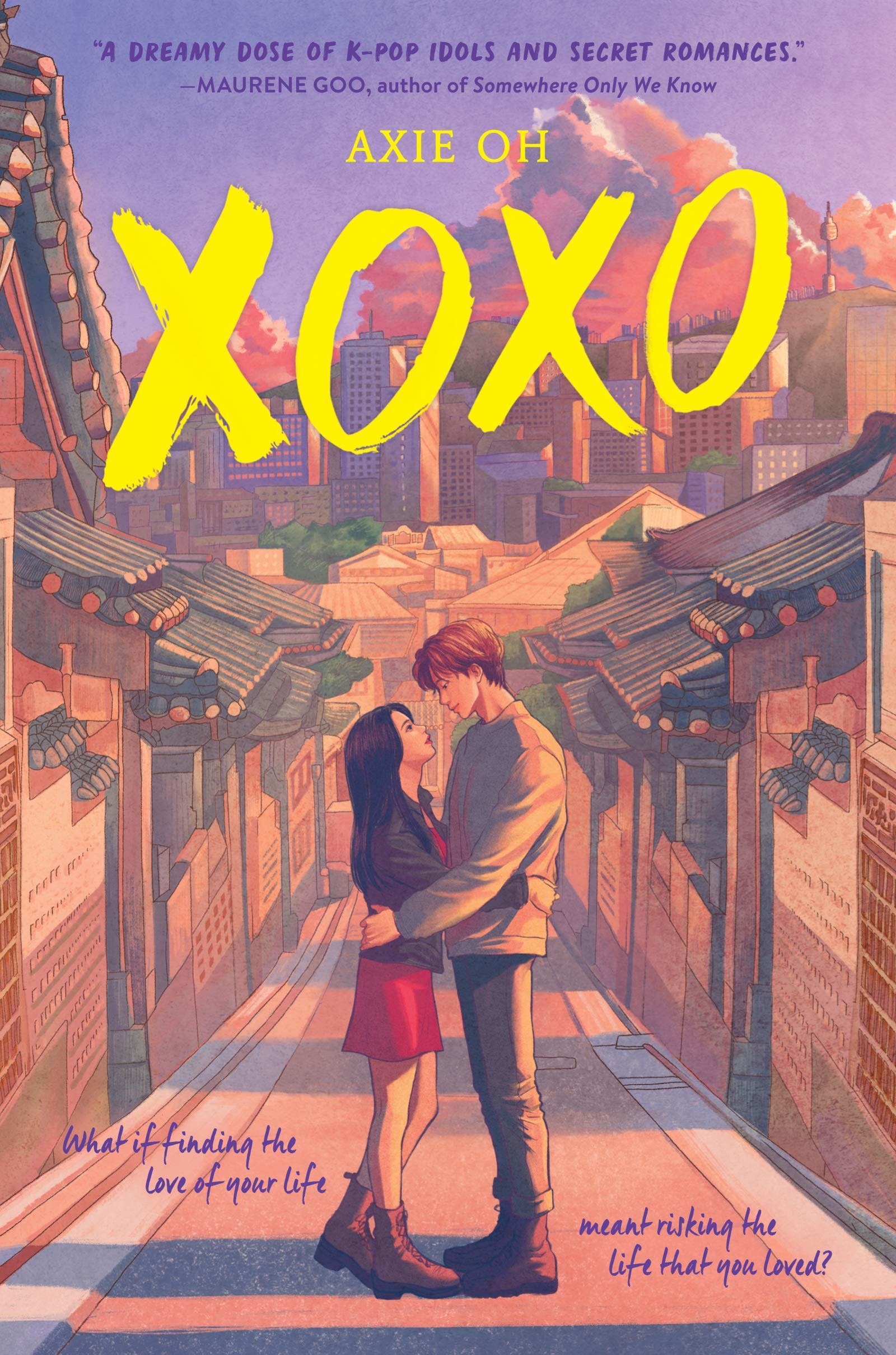 A girl and boy hold each other in sunset filled alleyway in Seoul
