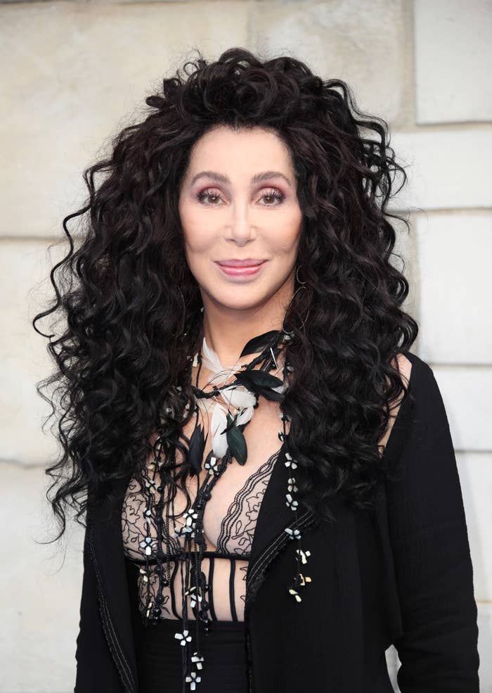 Cher smiles for a photo at an event