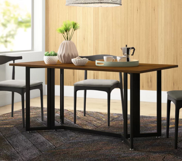 A wooden brown rectangular top dining table with metal legs. The table is collapsible with two drop leaves.