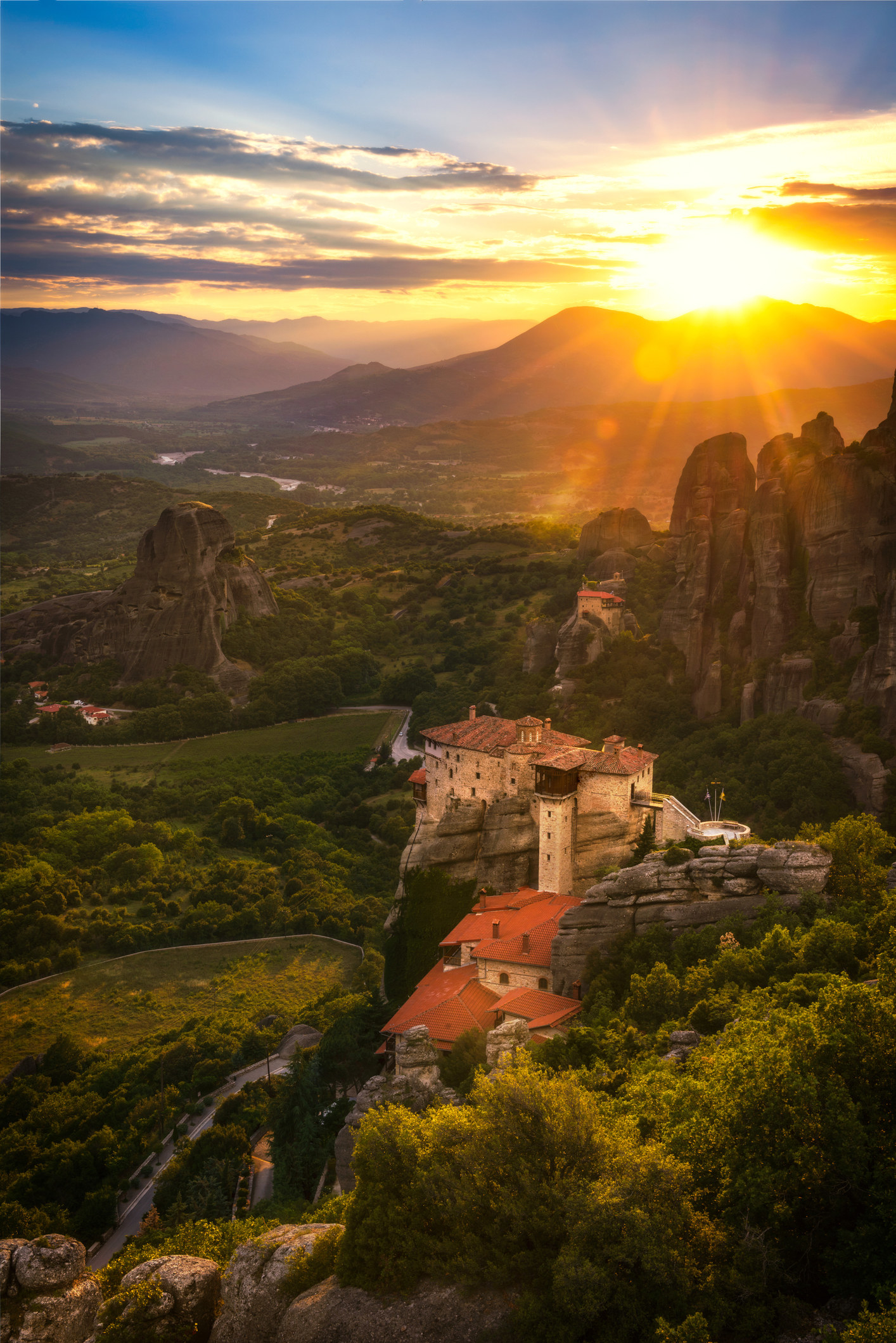 The sun setting over a beautiful, steep landscape