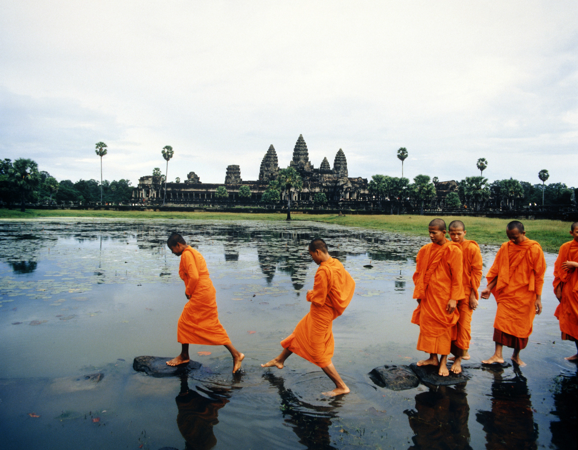 Monks walking near Angkor Wat