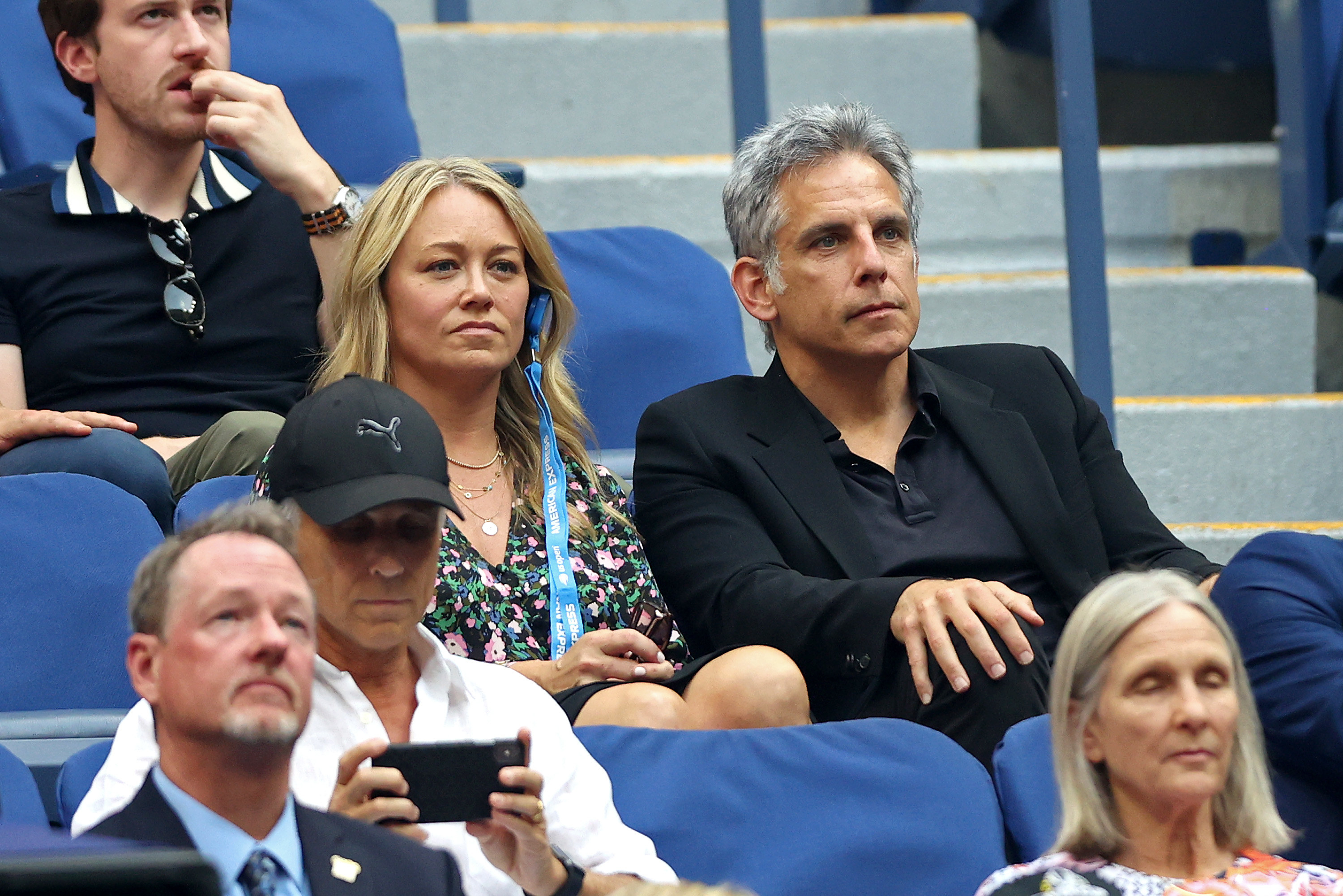 Christine Taylor and Ben Stiller sitting together at a tennis match