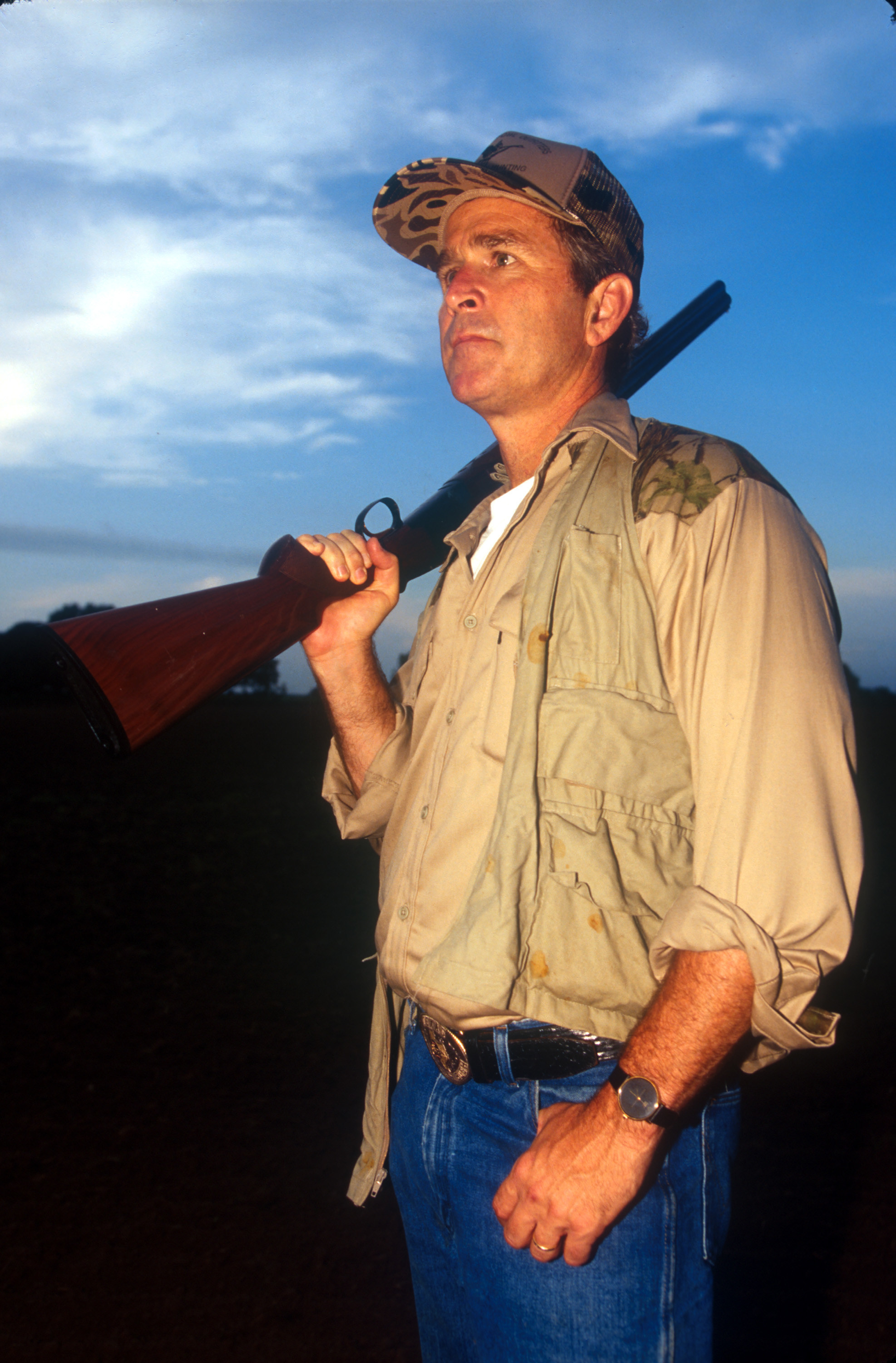 George W. Bush holding a shotgun