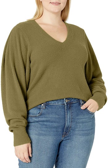 Model wearing the green v-neck