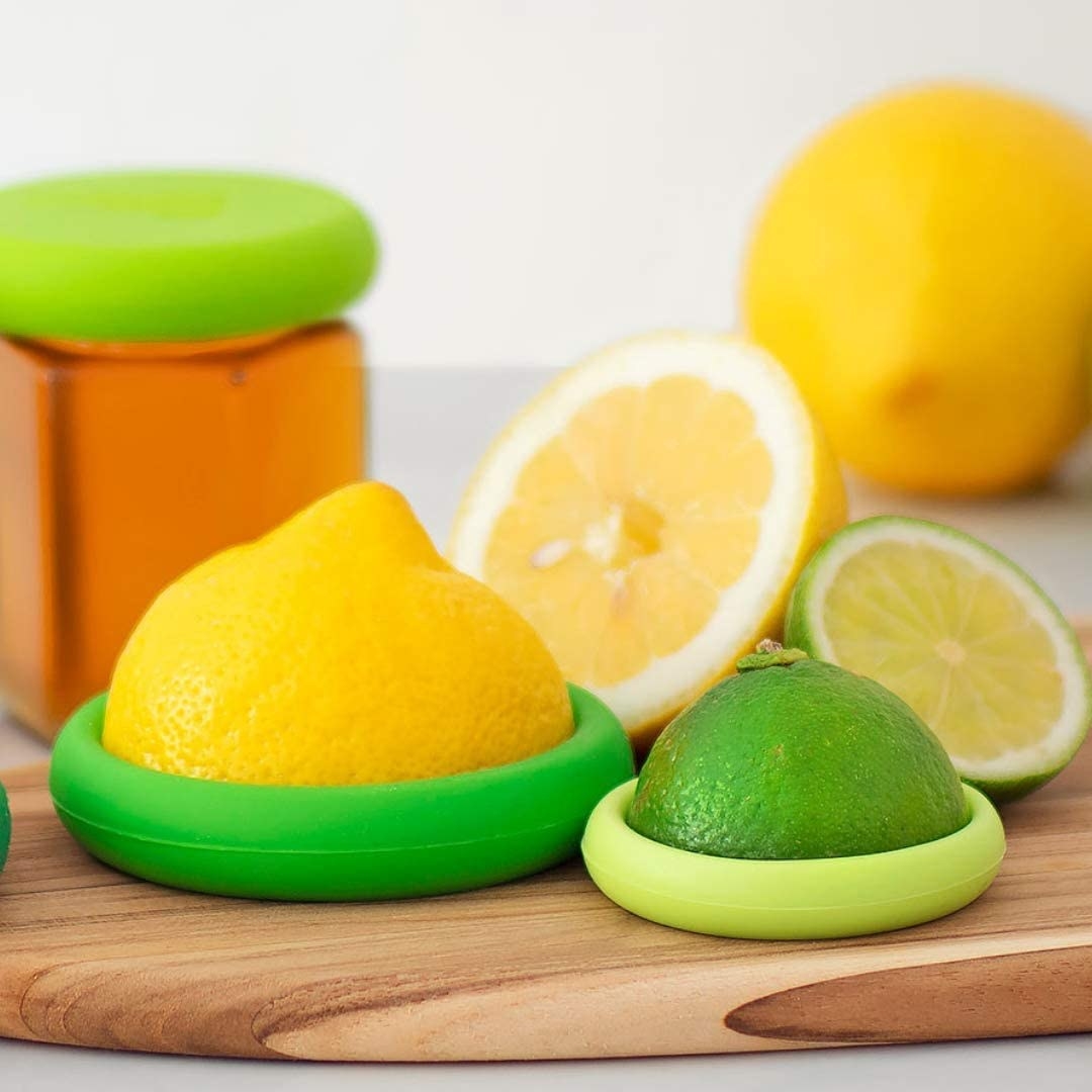 Citrus huggers around a lemon and a lime