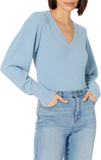 Model wearing the light blue sweater with jeans