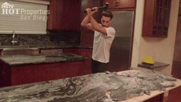 Smashing a granite countertop with a sledgehammer with caption: &quot;TODAY&#x27;S MOOD&quot;