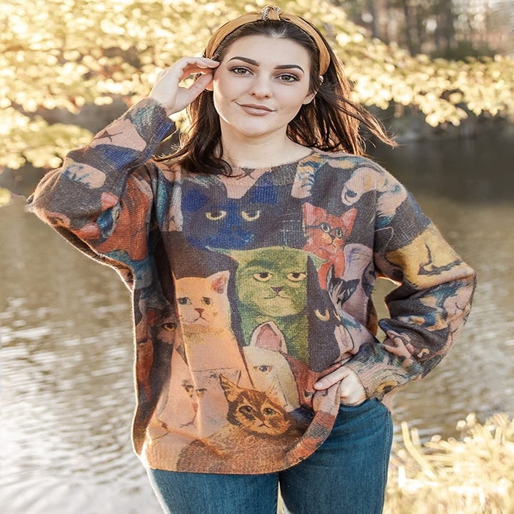 Model wearing the cat sweater loose