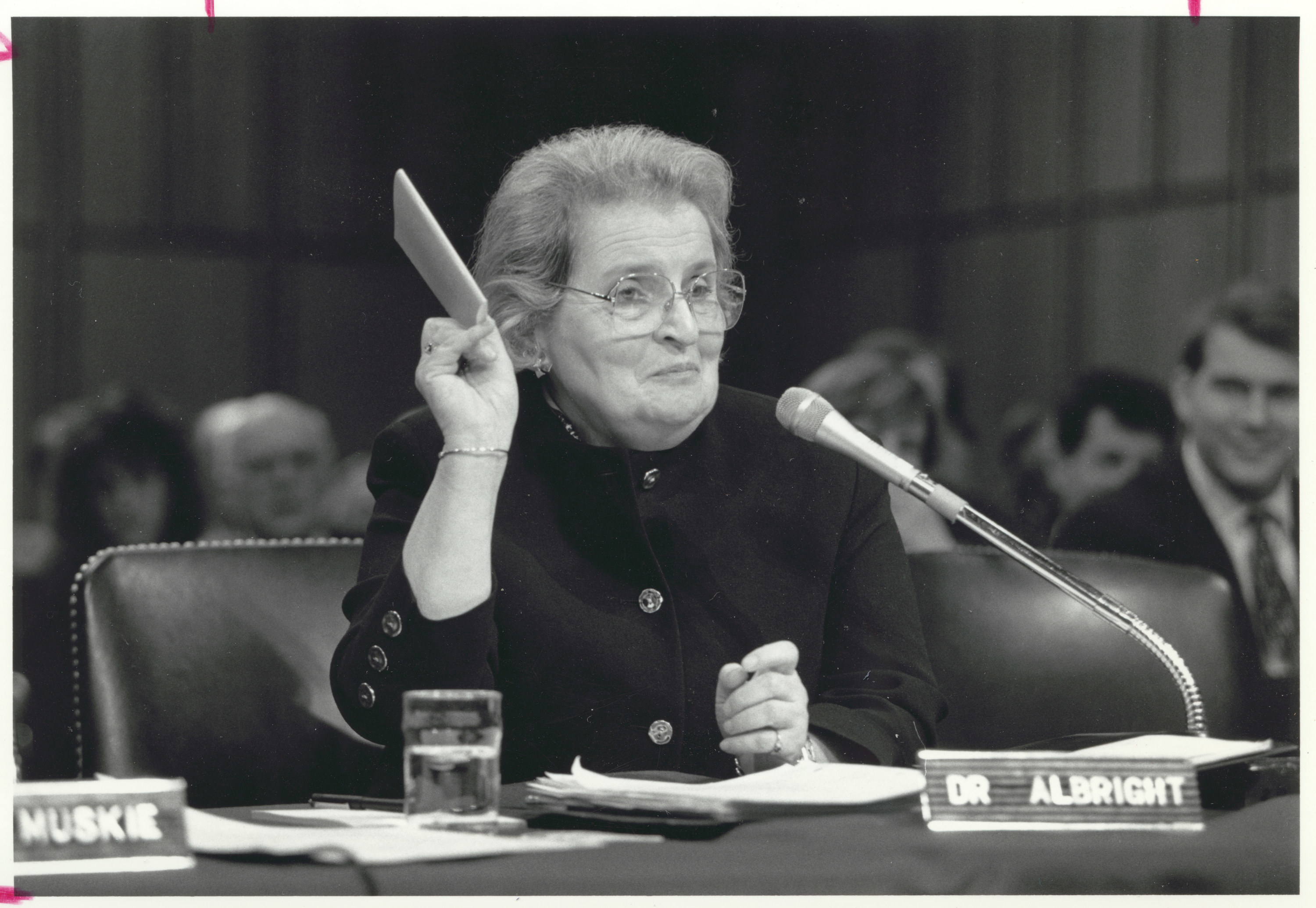 Madeleine Albright holding a piece of paper