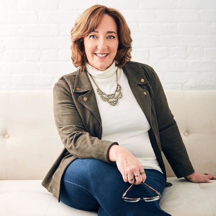 Reviewer wearing the white turtleneck under a blazer