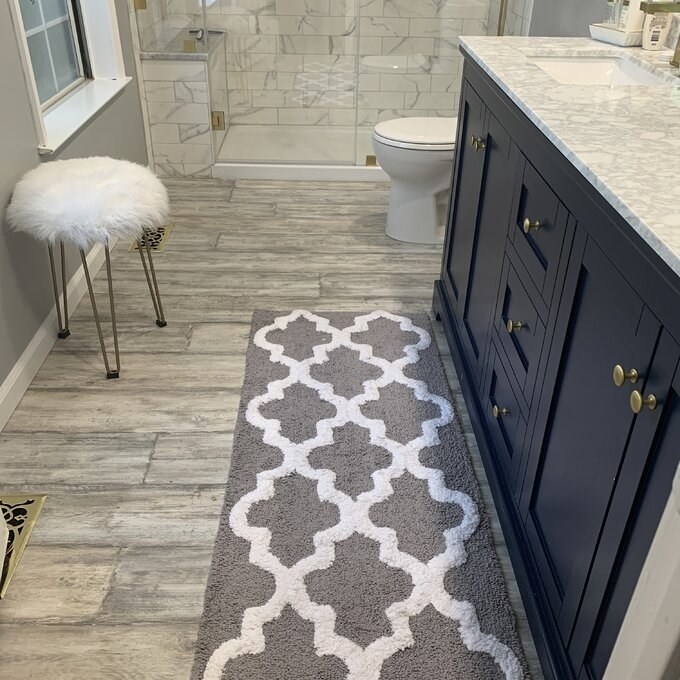 reviewer photo of the bath rug in gray