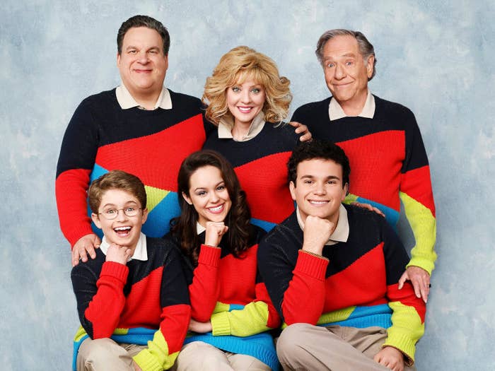 The Goldberg family in a promotional image wearing matching multicolored sweaters