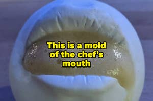 A mold of the chef's mouth with the dish inside