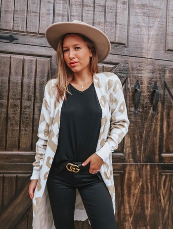 reviewer wearing the white and tan duster cardigan