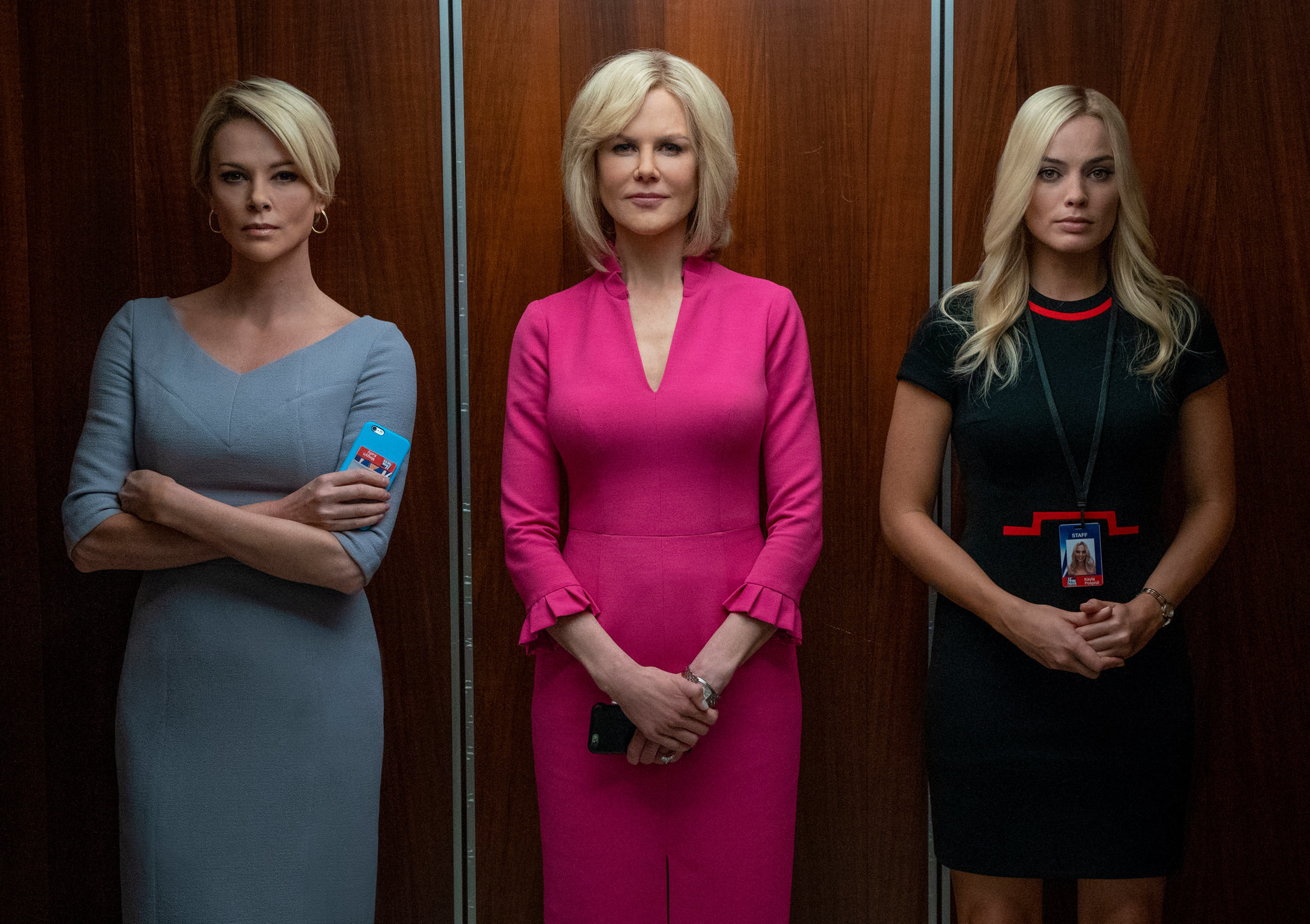 charlize theron, nicole kidman, and margot robbie as megyn, gretchen and kayla, standing in an elevator