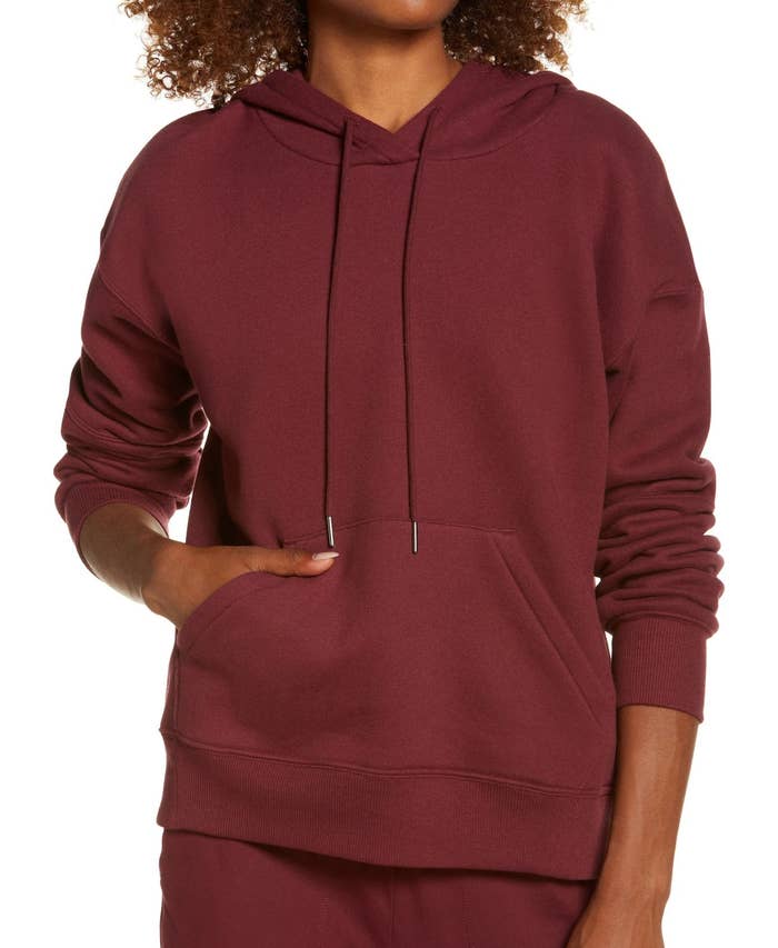 model wearing Cara hoodie in burgundy