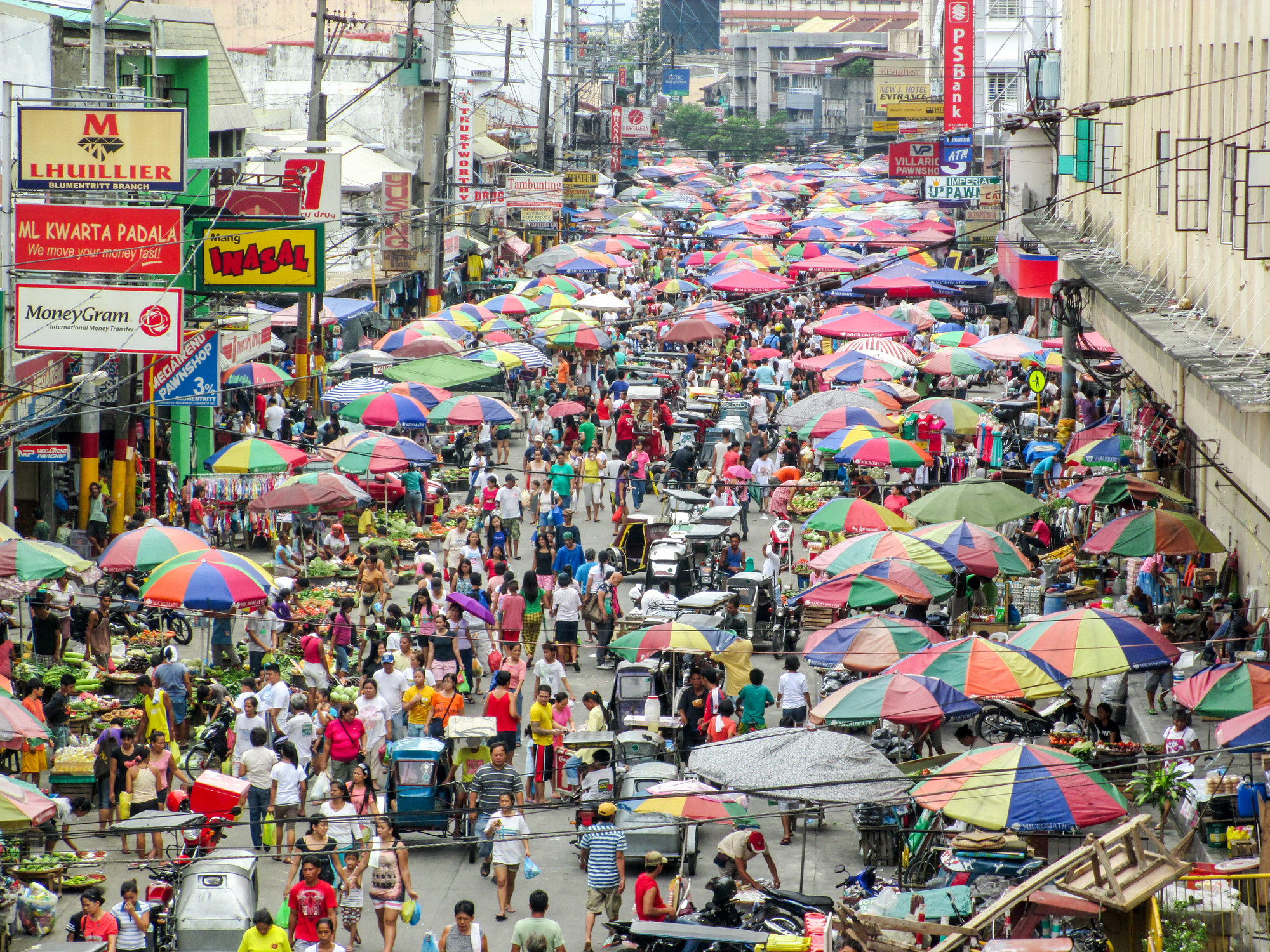 A high angle view of people at a busy market in a city