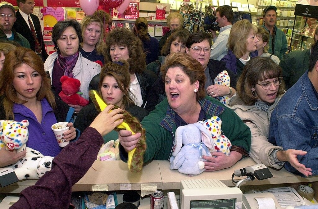 a group of people freaking out over beanie babies