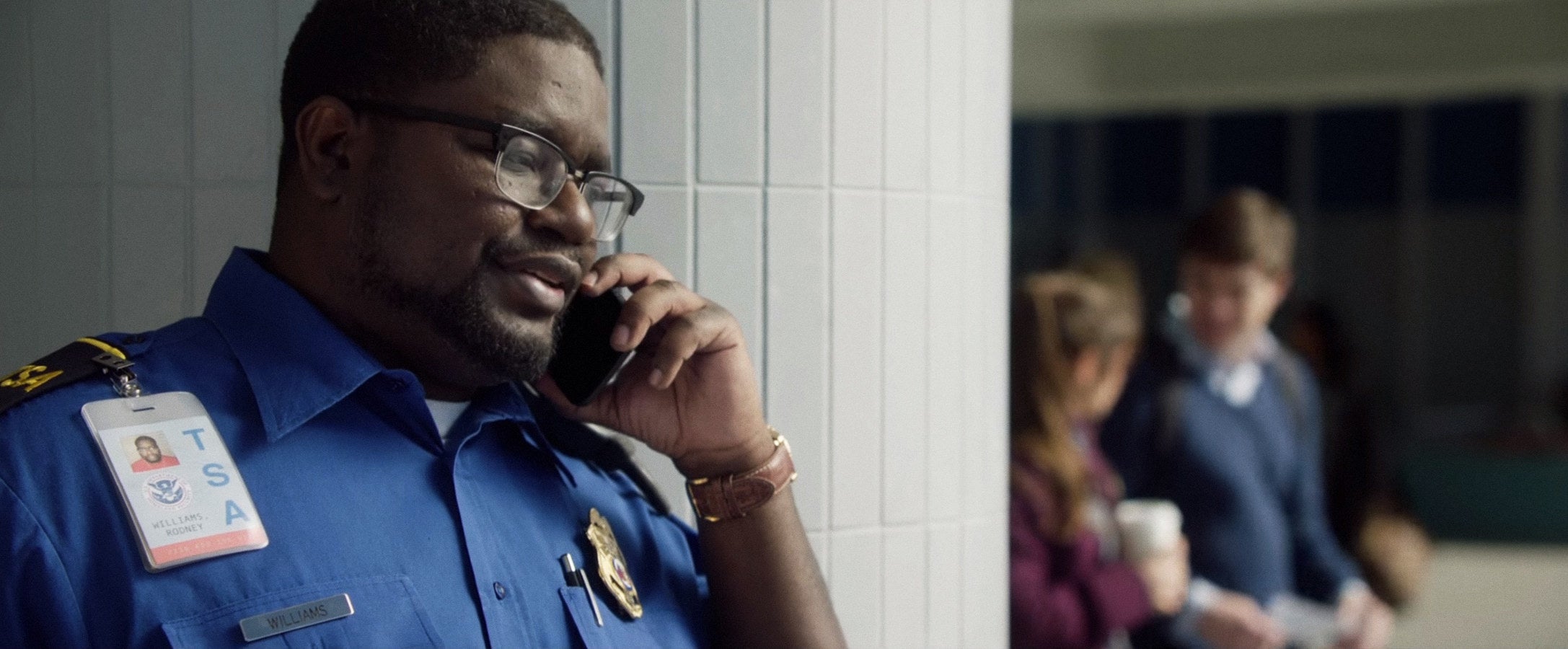Rod answering the phone at his TSA job