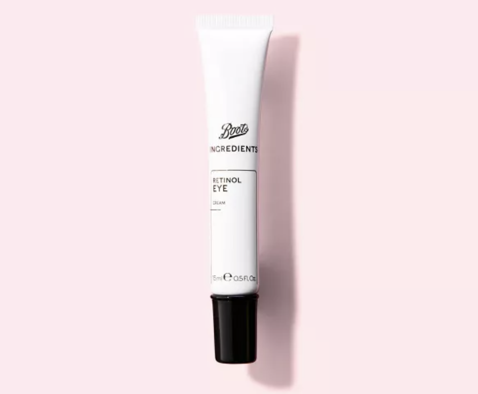 Black and white bottle of Boots retinol eye cream on a light pink background