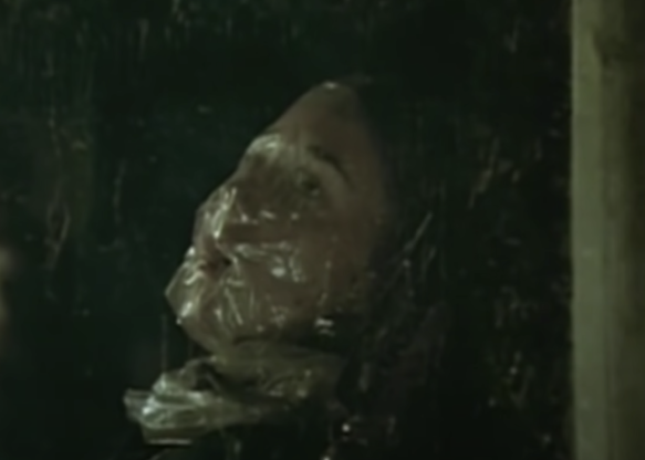 A dead body in a window